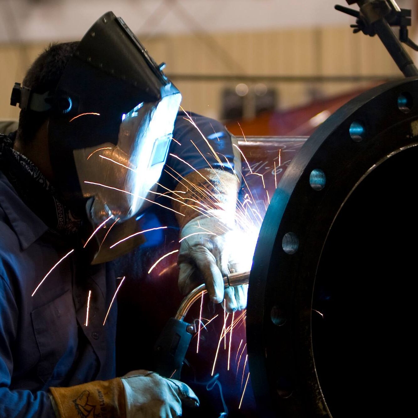 A welder working on a trade project